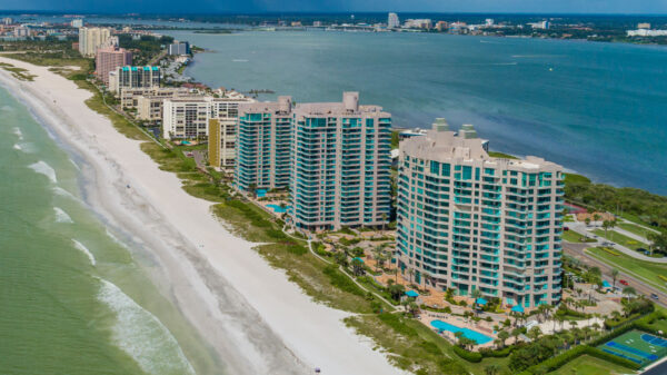 image from the air of condos on the beach with Clearwater in the background